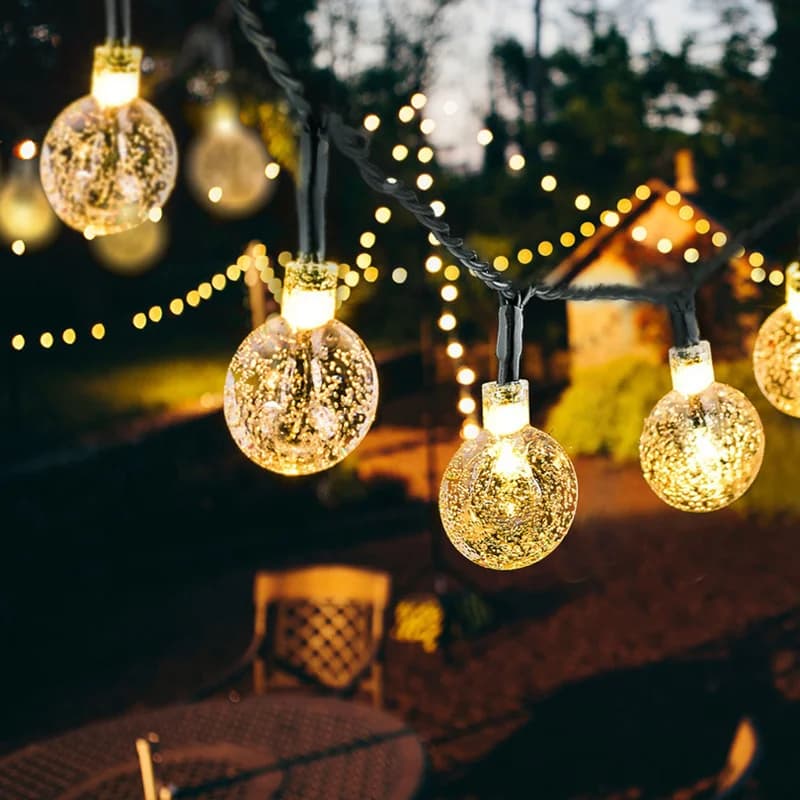 Łańcuch lampek LED z kulkami typu bubble, ciepłe białe, zasilane energią słoneczną